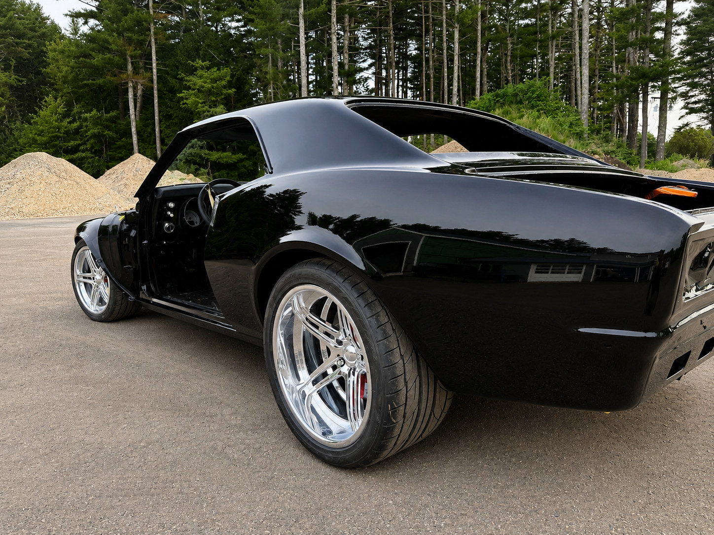 Finished black custom — rear three-quarter view