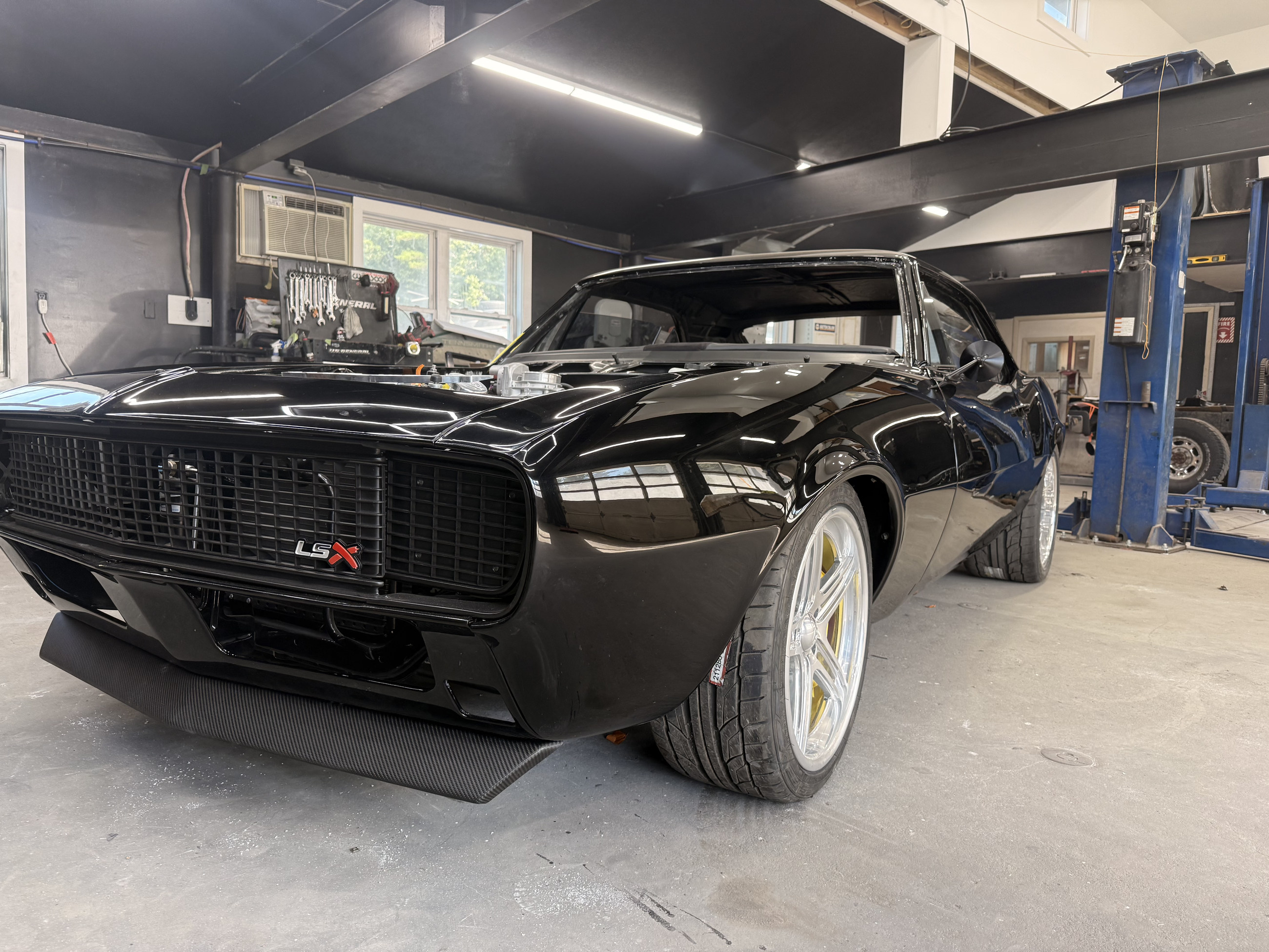 Finished black custom — front three-quarter view
