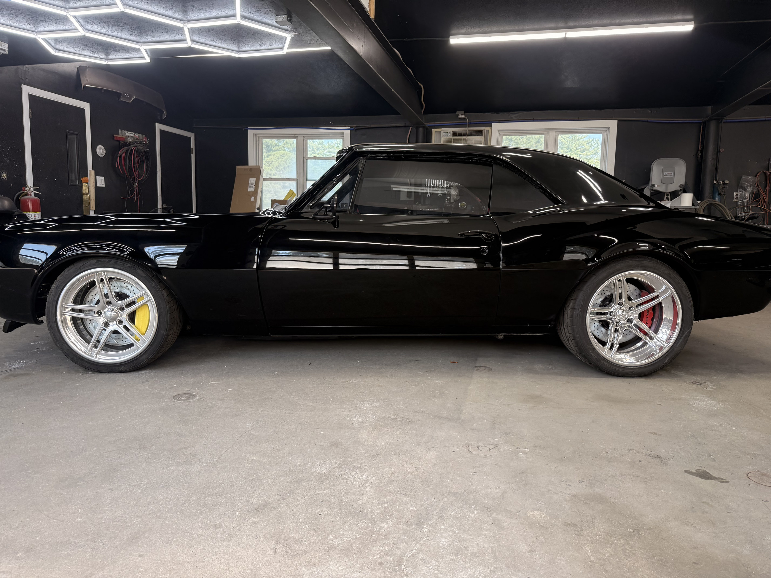 Finished black custom coupe side profile