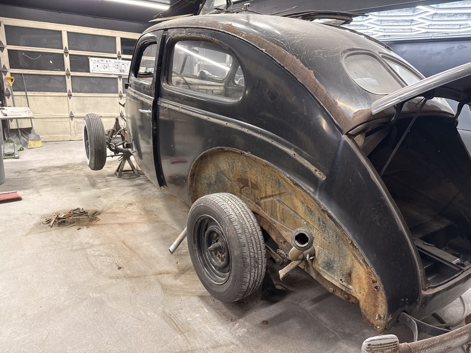 Body restoration with rear quarter repair work