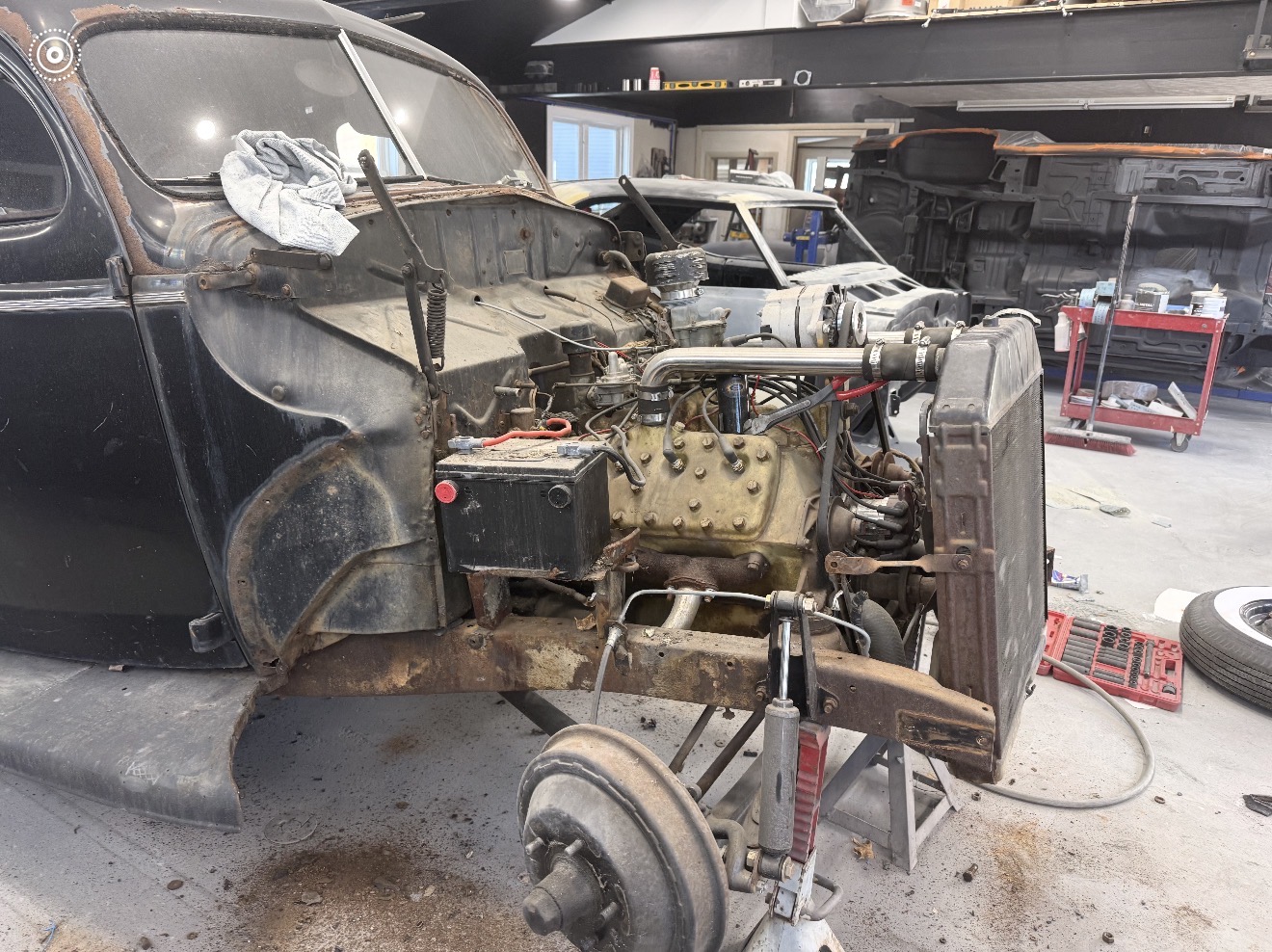 Original photo of engine and front suspension restoration
