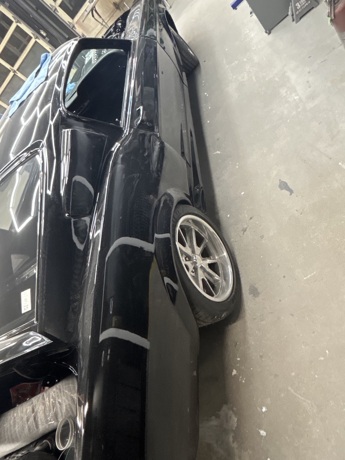 Final fitment detail on a black custom build